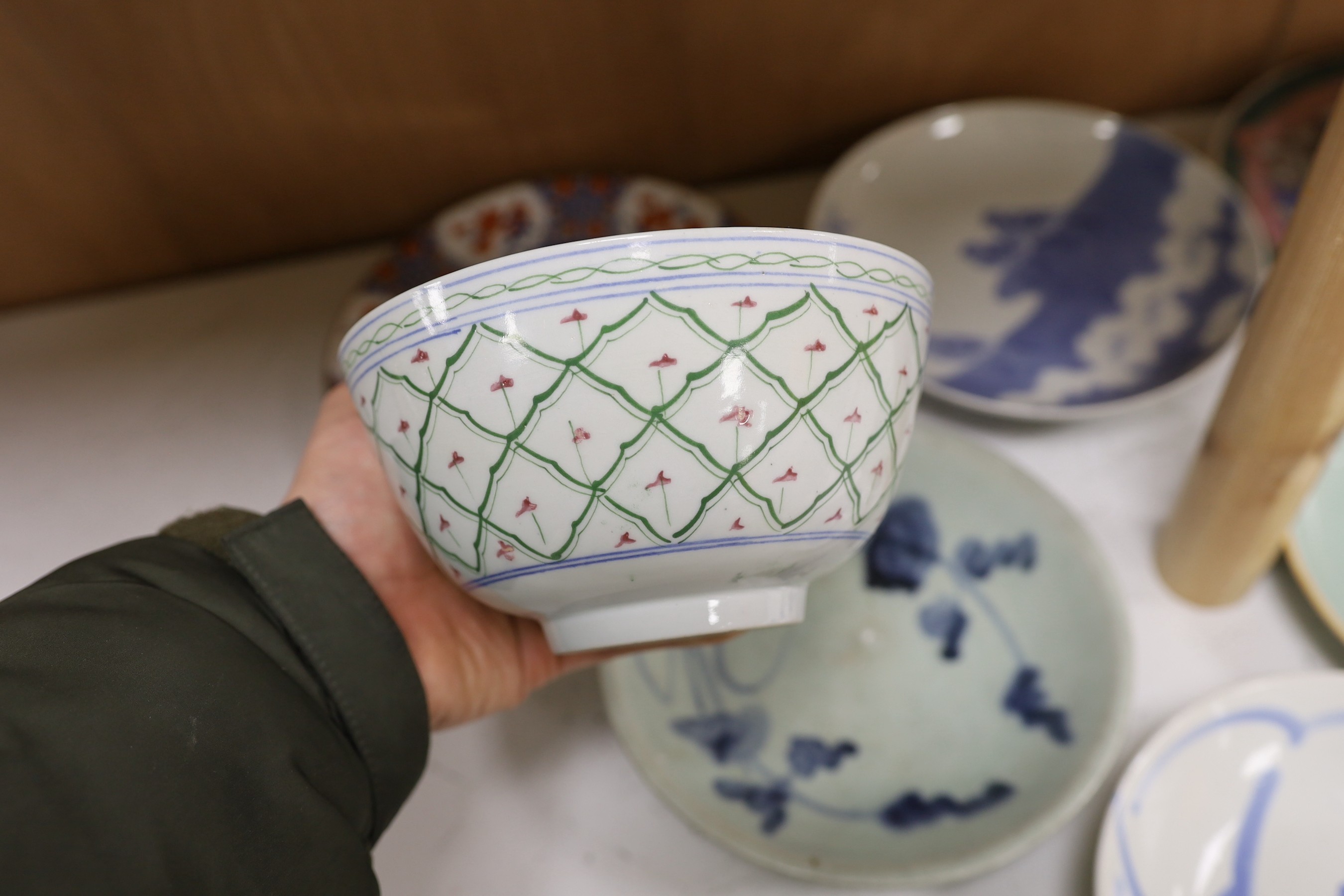 A group of Chinese plates and dishes including a Ming dynasty blue and white bowl